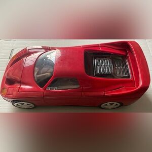 Vintage VHS Tape Rewinder Red Sports Car with Aerodynamic Design
